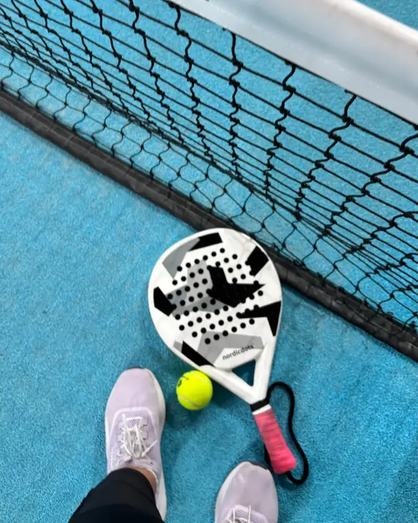 Racket and ball at the net